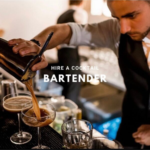 Cocktailhire bartender pouring cocktails across the bar during service