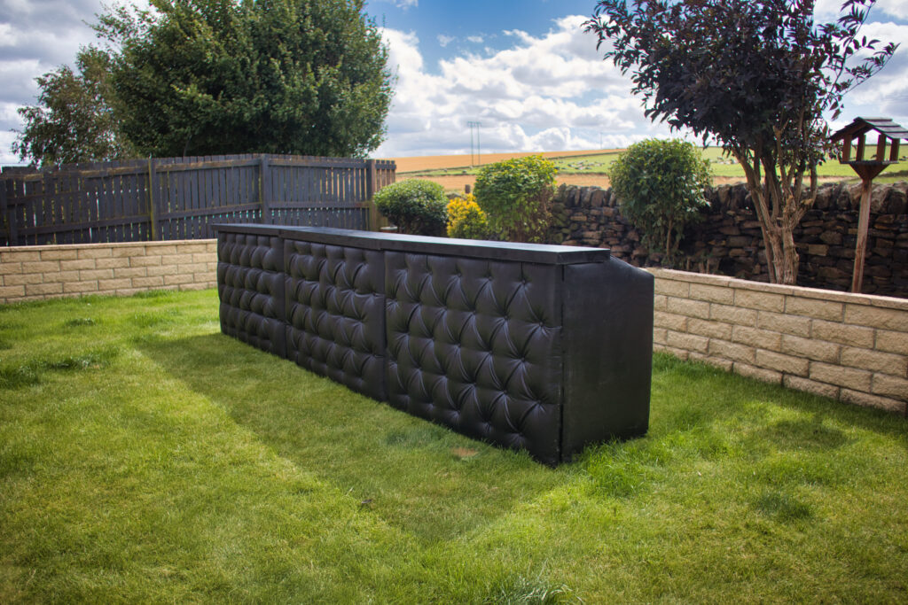 Black chesterfield bar setup for an event