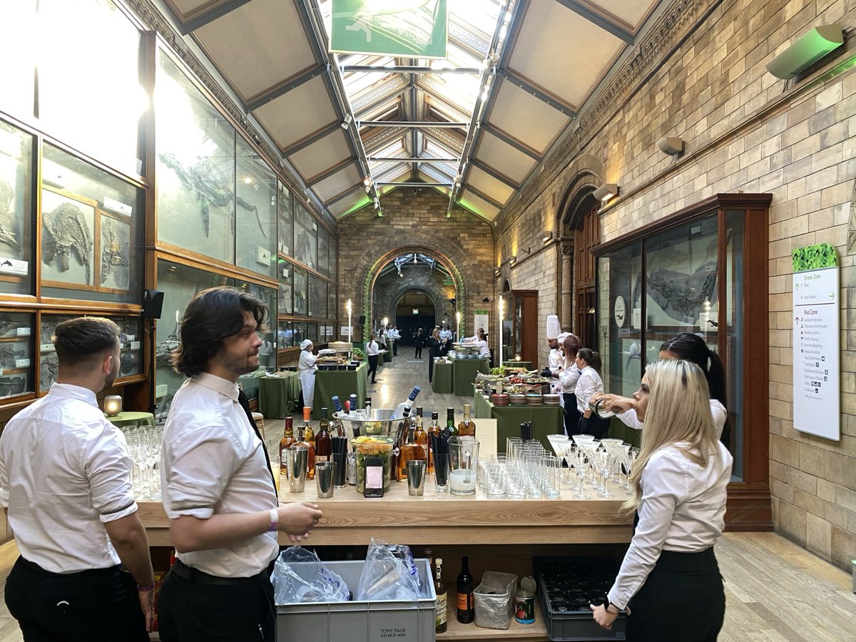Cocktailhire bartenders behind the service point at the Natural History Museum
