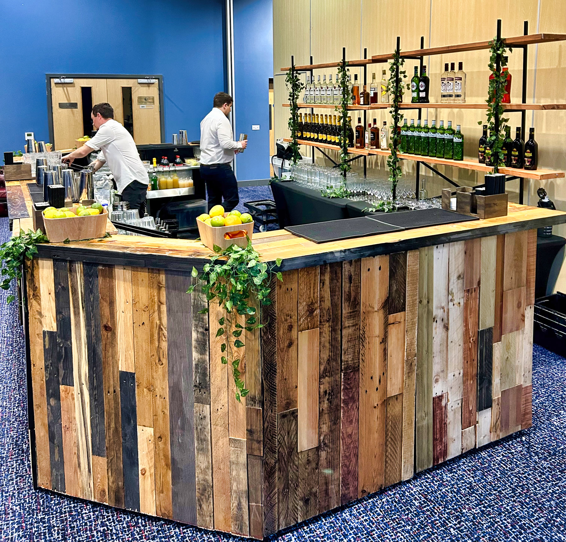 Wooden horseshoe mobile bar installed for service